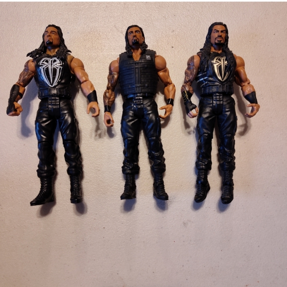 Roman Reigns wrestling figurines (3)